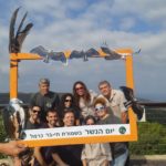 צילום קבוצתי של אנשי רשות הטבע והגנים ביום הנשר בחיפה (צילום: מאיה קדוש-חכמון)