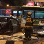 תאונה בין רכב פרטי לאוטובוס בחיפה • הרכב עלה באש (צילום: כבאות והצלה)