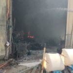 מחסן עולה באש בכפר חסידים (צילום: כבאות והצלה)