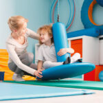 Boy using sensory integration equipment