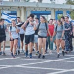 ריצה, חטופים, BringThemHomeNow, החזרה, כיכר, שלט, סרט, צהוב, תמיכה, הזדהות, קהילה, תרגול, מדיטציה, מתרגלים, אירוע, מחאה, שקט, יחד, תקווה, גוף, נפש, ריכוז, מטה, תמונות, עצרת, משפחות, מיצג, אומנות, כיסאות, שולחן, שבת, מנהרה, מוזיאון, ישראל, מלחמה, אוקטובר, שלטים, רחובות, עיר, פוסטרים, לב, שבור, געגוע, עכשיו, מרוץ, מרתון, רצים, רצות, דגלים, נאומים, קהל, במה, זעקה, שולחן, מדבקות, סטיקר, הביתה, חולצות, אנגרסט, חולצות, חולצה