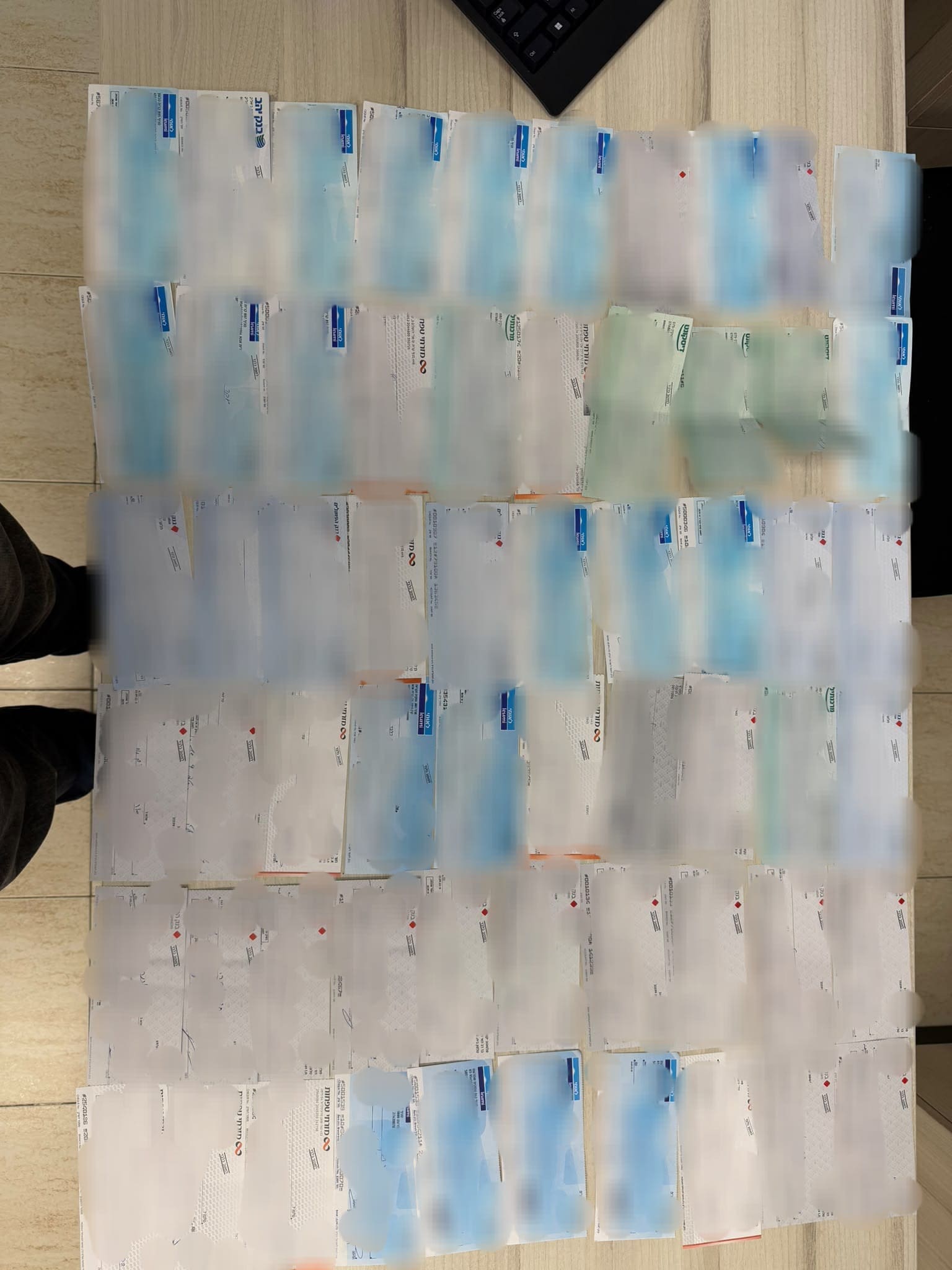 כ-7.8 מיליון שקלים נתפסו בפשיטה על חשוד בהלבנת הון בקריית חיים 18/8/26 (צילום: דוברות המשטרה)